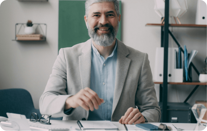 School leader at his desk