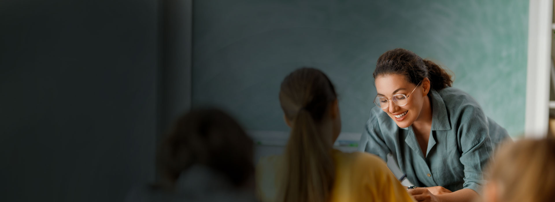 Teacher supporting a student